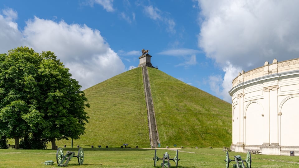 view of the Lion's Mound and cannons at the Waterloo Battlefield Memorial outisde of Brussels