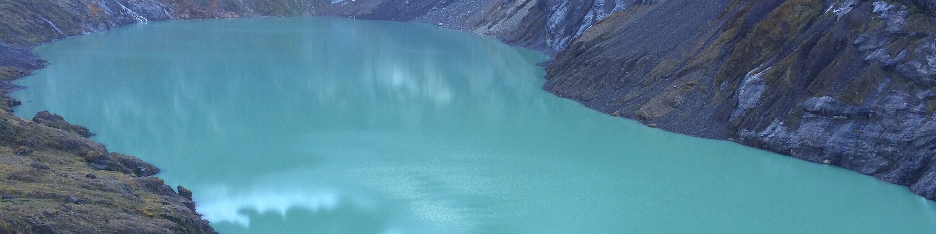 The Altar is an extinct volcano on the Western side of Sangay National Park in Ecuador, 170 km south of Quito. Altar was active about 2 million years ago and containsa boiler open towards the West, containing a Lake of laguna yellow name. 
http://www.cotopaxi-travel.com/ecuador-trekking-altar-volcano.php