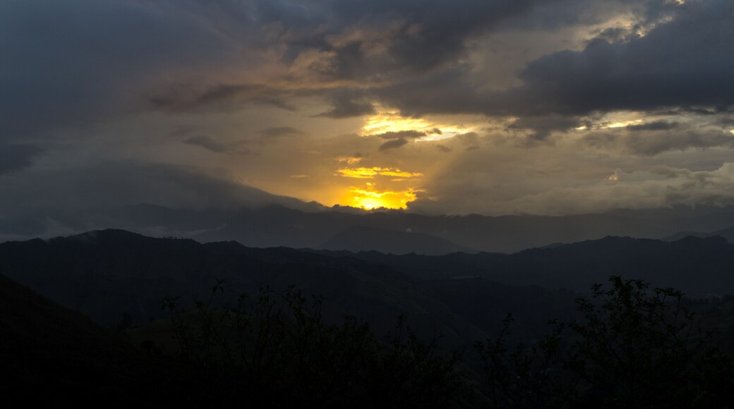 Sunset at the Vilcabamba Valley. Sun is hiding behind the mountains. Loja, Ecuador