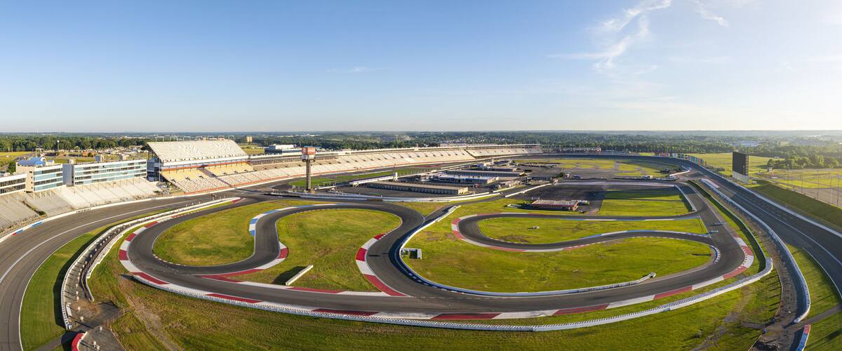 A racetrack with multiple curves and a grandstand.