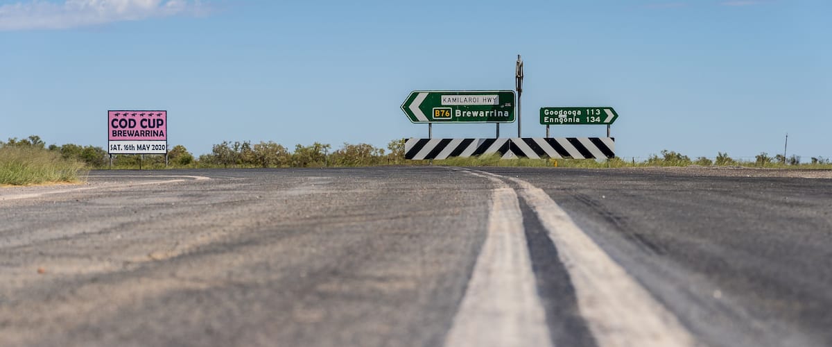 A road with directional signs for Kamilarai Hwy, Brewarrina, and Gondwana.