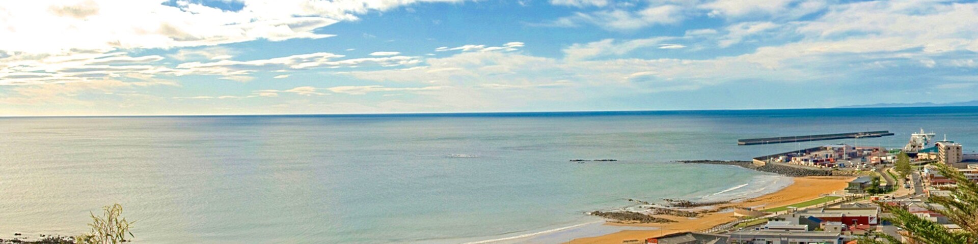 Burnie showing a beach and a coastal town