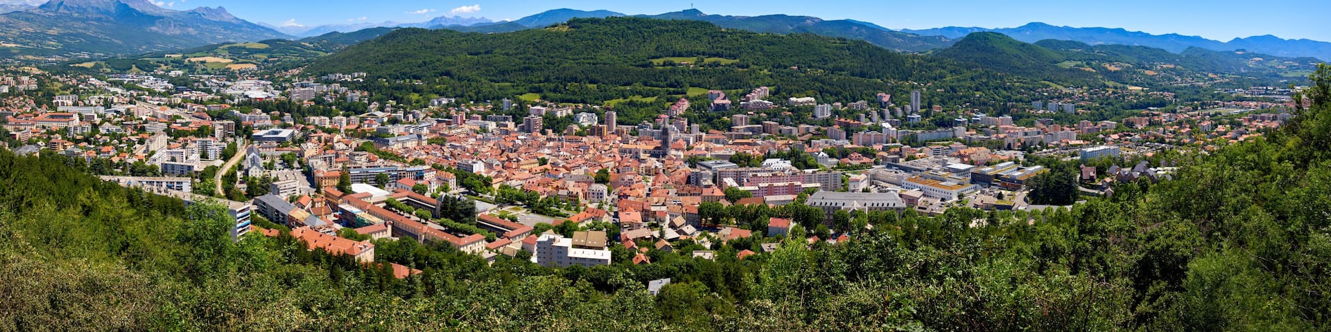 Elevated panoramic view of the city of Gap in the Hautes-Alpes in Summer. Southern French Alps, France