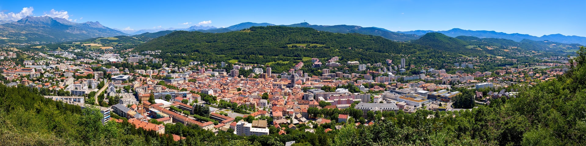 Elevated panoramic view of the city of Gap in the Hautes-Alpes in Summer. Southern French Alps, France