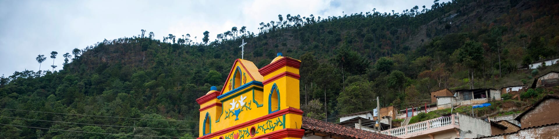 Colour facade of the church in the San Andres Xecul in Guatemala, Central America