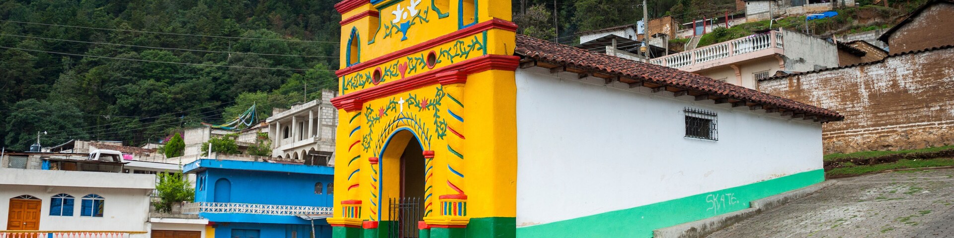 Colour facade of the church in the San Andres Xecul in Guatemala, Central America