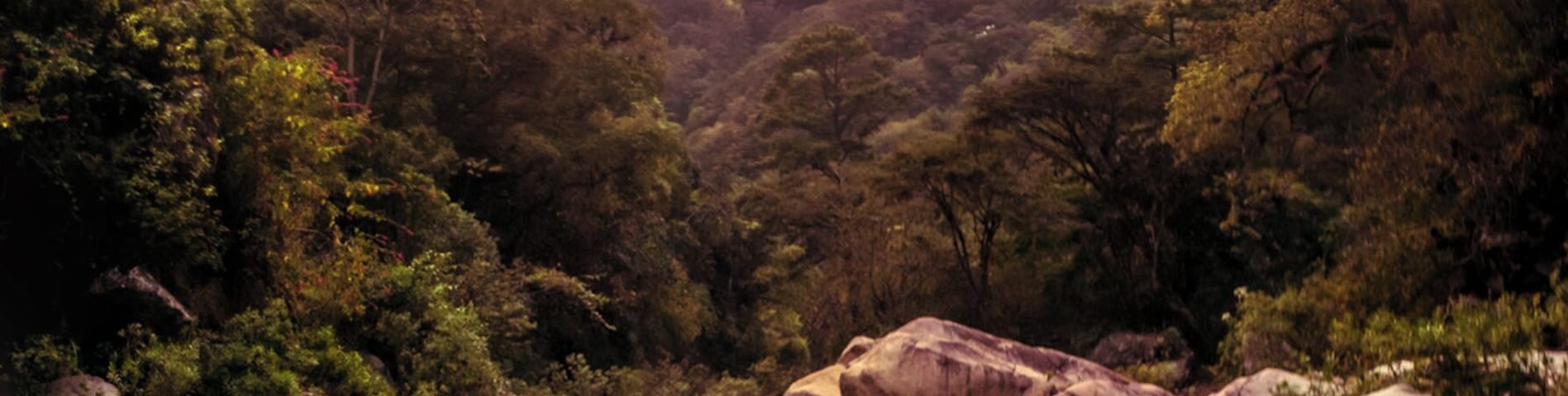 Taking a cold shower on a river after a long day of hiking through the guatemalan countryside.