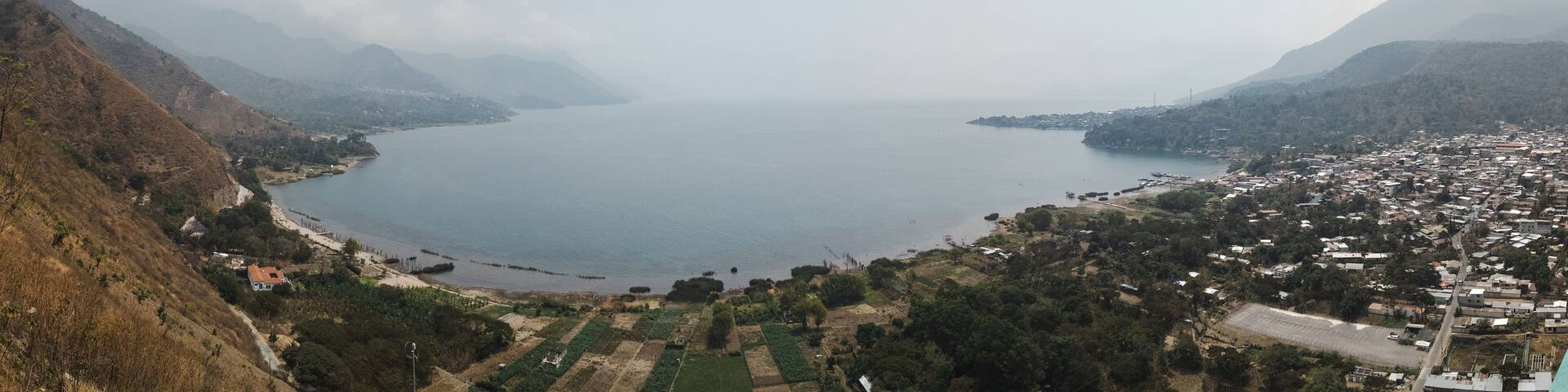 Panorama city view of San juan la laguna on lake atitlan on a smoky day