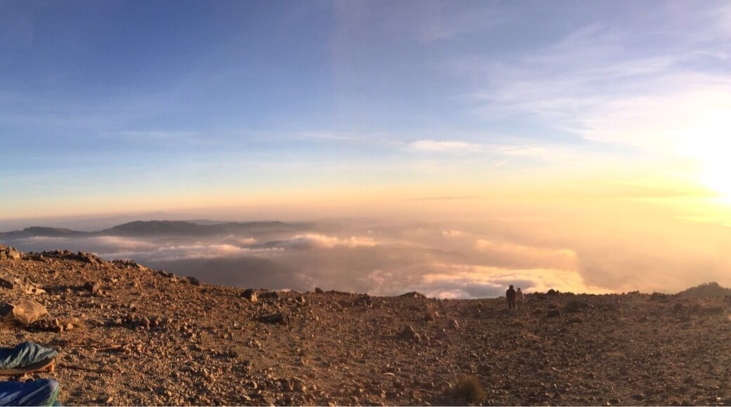 Sunrise from the main peak of Tajulmuco. We hiked with Quetzaltrekkers and camped overnight a few hundred meters from the top. Highly recommended view of the highest point in Central America.