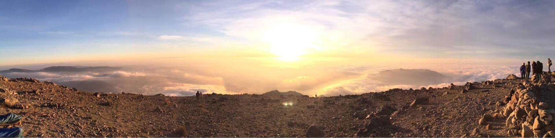 Sunrise from the main peak of Tajulmuco. We hiked with Quetzaltrekkers and camped overnight a few hundred meters from the top. Highly recommended view of the highest point in Central America.