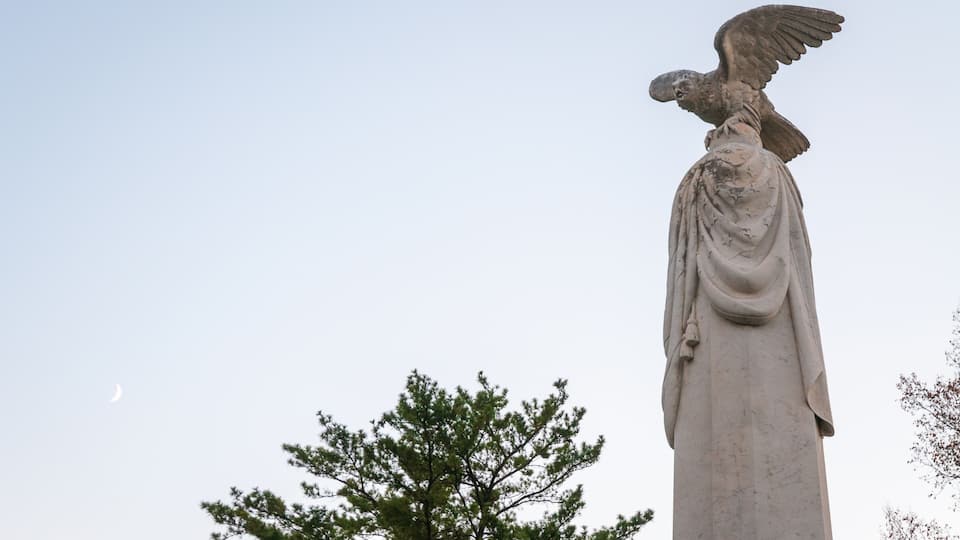 A statue of an eagle with outstretched wings.