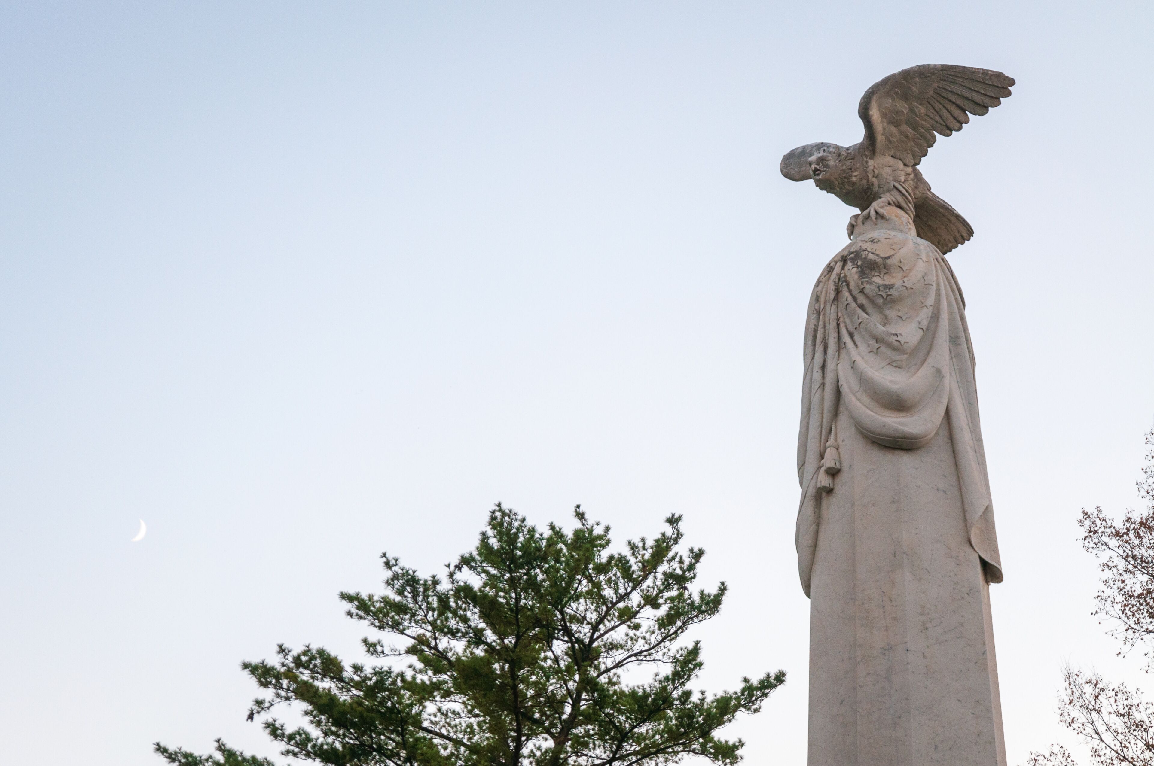 A statue of an eagle with outstretched wings.