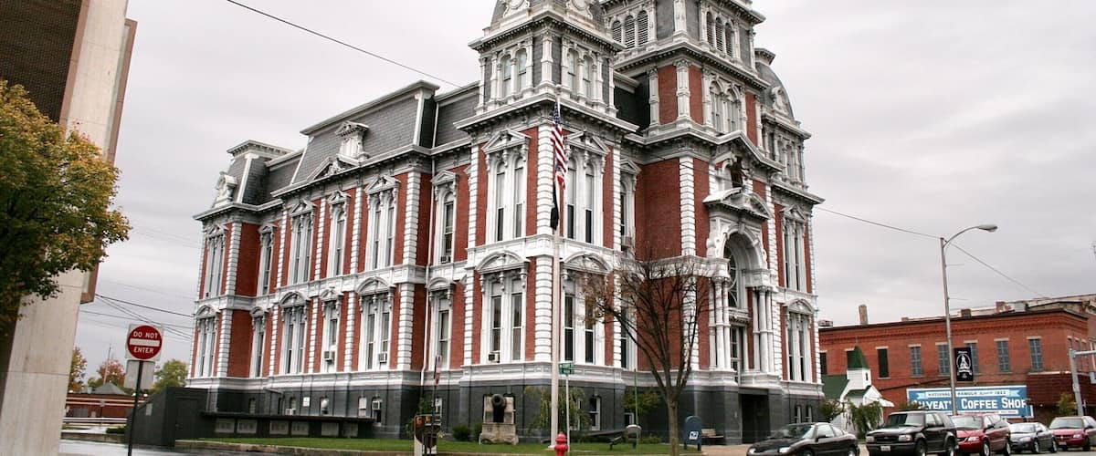 A historic building with ornate architecture, including a clock tower and decorative windows.