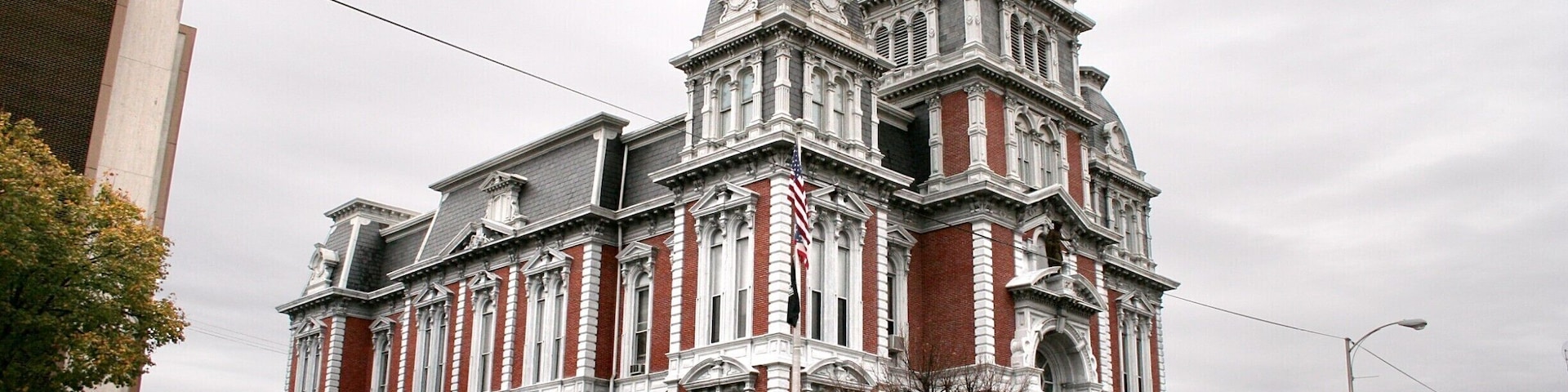 A historic building with ornate architecture, including a clock tower and decorative windows.