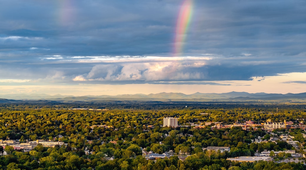 Queensbury, NY, USA - August 27, 2025: Late afternoon aerial view of a rainbow over the Queensbury / Glens Falls area near the southern boundary of the Adirondack Park of of Interstate 87.