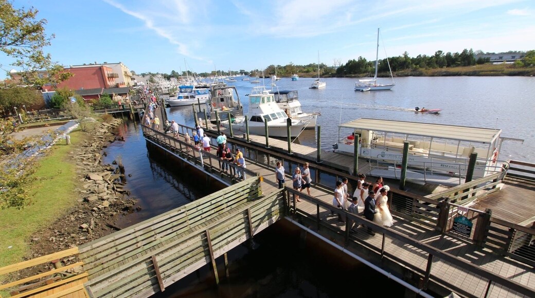 The Wooden Boat Show in Georgetown, SC is a annual event celebrating Georgetown's heritage as a boat-building seaport. The festival is in full swing as a wedding party makes its way down the Harborwalk, October, 21, 2017.