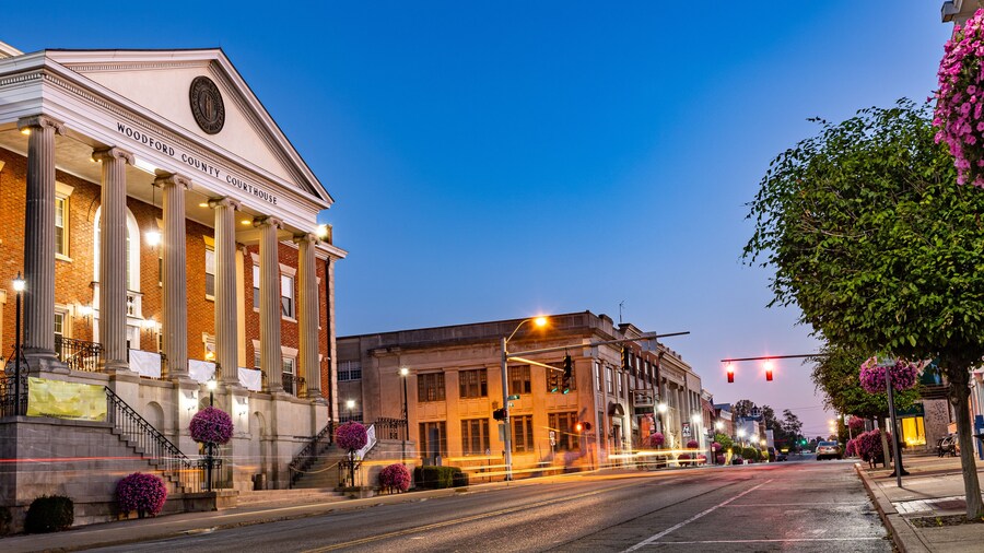 Taillights trails of early morning traffic on Main Street of a small mid west city of Versailles, KY in front of Woodford county courthouse