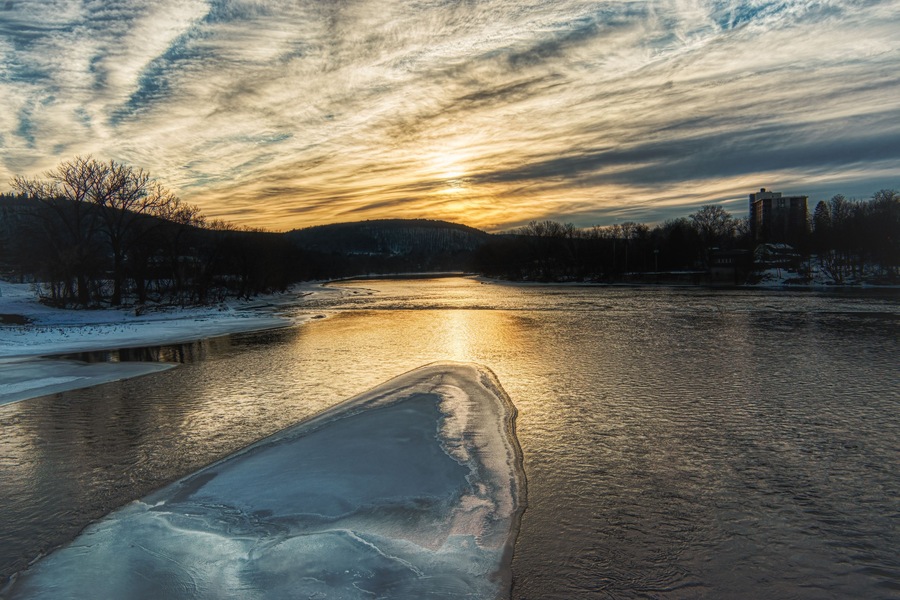 Taken from the South Washington Street Bridge in Binghamton in Upstate NY. Ice on the river at Sunset. This is the point where the Chenango and the Susquehanna River Converge into one.