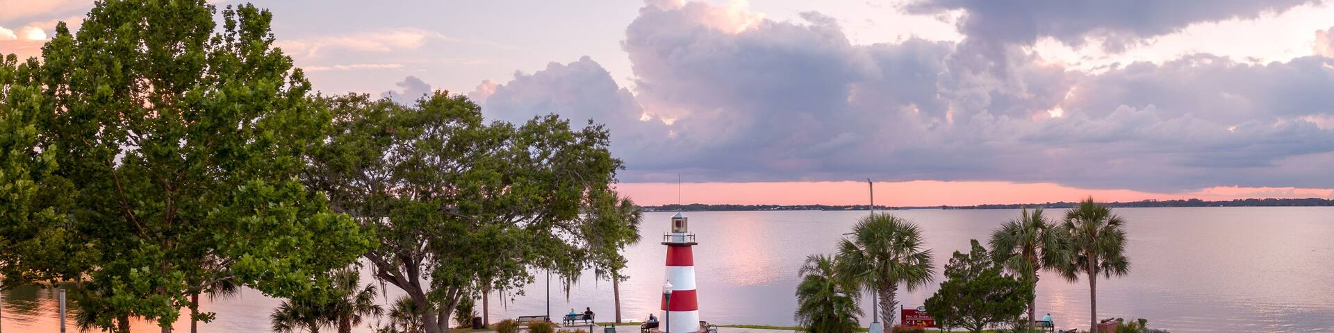 Mount Dora Lighthouse on Lake Dora at sunset with dramatic clouds. Florida, USA. May 18, 2023.