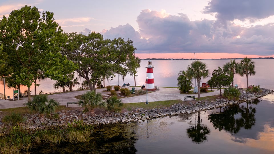 Mount Dora Lighthouse on Lake Dora at sunset with dramatic clouds. Florida, USA. May 18, 2023.