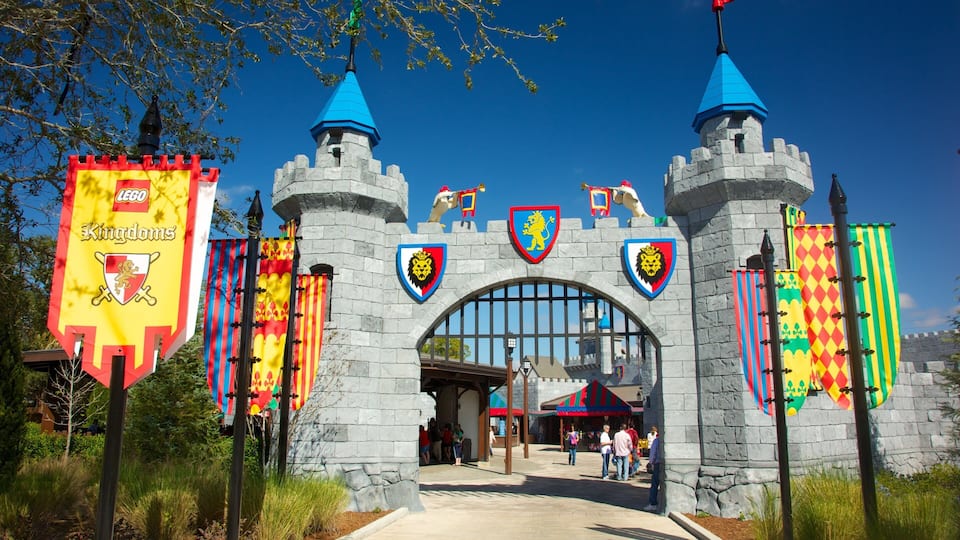 A castle entrance with flags and banners, including a LEGO Kingdoms banner.
