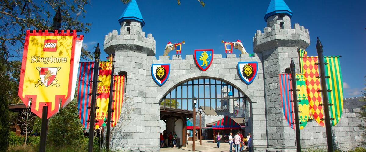 A castle entrance with flags and banners, including a LEGO Kingdoms banner.