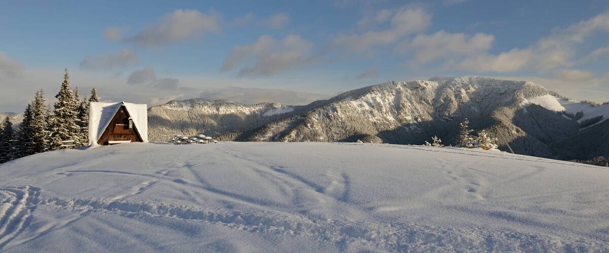 JASNA, SLOVAKIA - It is the largest ski resort in Slovakia with 49 km of pistes in Jasna, Slovakia. Snow, sunny winter day, closed restaurant