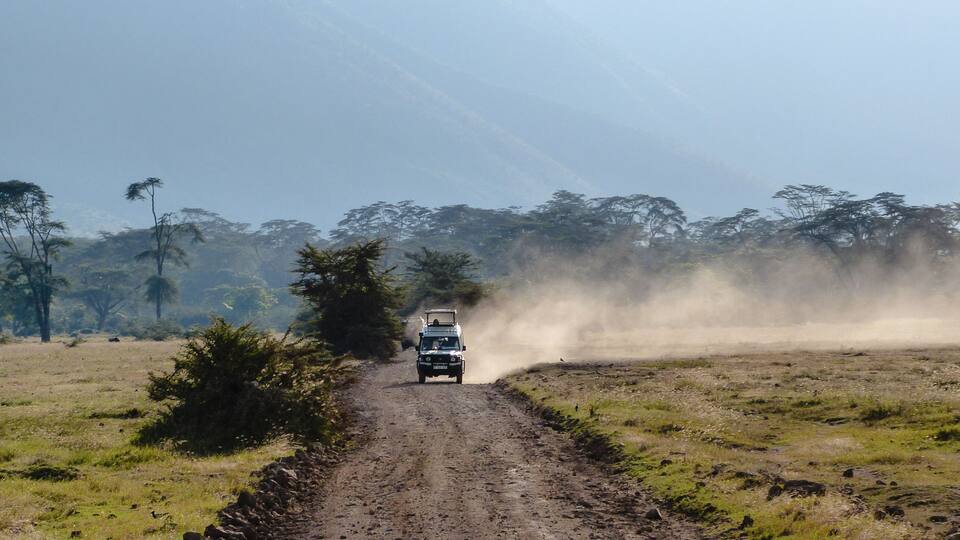 4x4 jeep driving in the Ngorongoro Crater near Serengeti National Park, Tanzania, Africa.