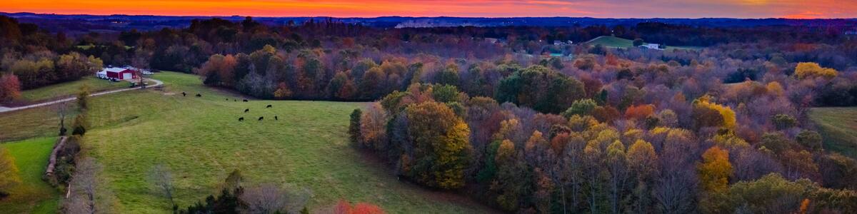 Red sky sunset over autumn forest and agricultural fields near Glasgow, Kentucky