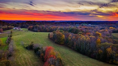 Red sky sunset over autumn forest and agricultural fields near Glasgow, Kentucky