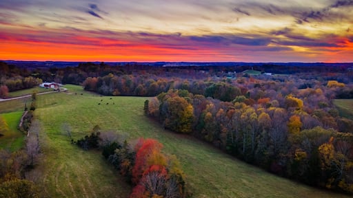 Red sky sunset over autumn forest and agricultural fields near Glasgow, Kentucky