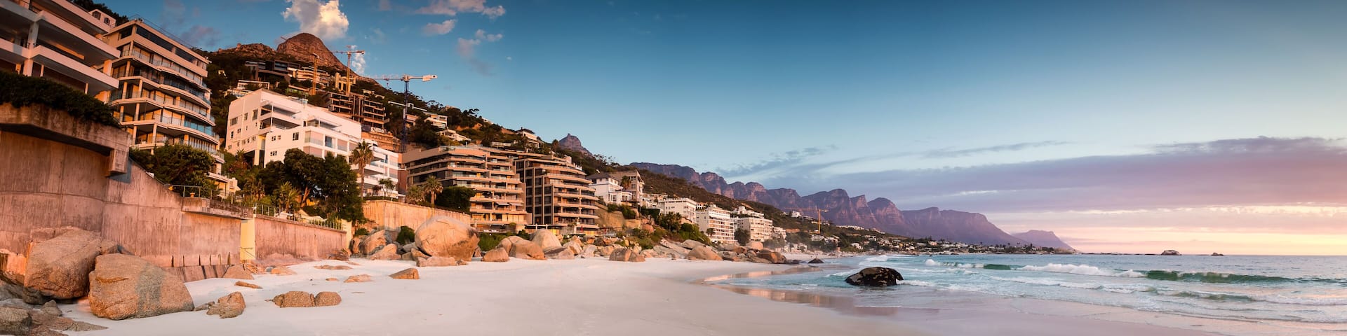 Wide angle landscape image over the multimillion dollar penthouse mansions that's built along the Clifton coast in Cape Town South Africa