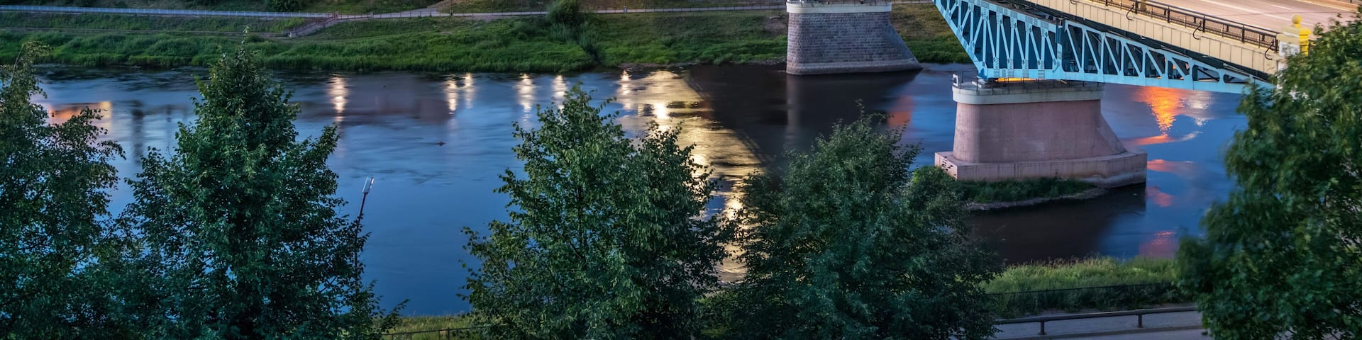 Cityscape of Grodno at dusk with bridge over Neman river, Belarus