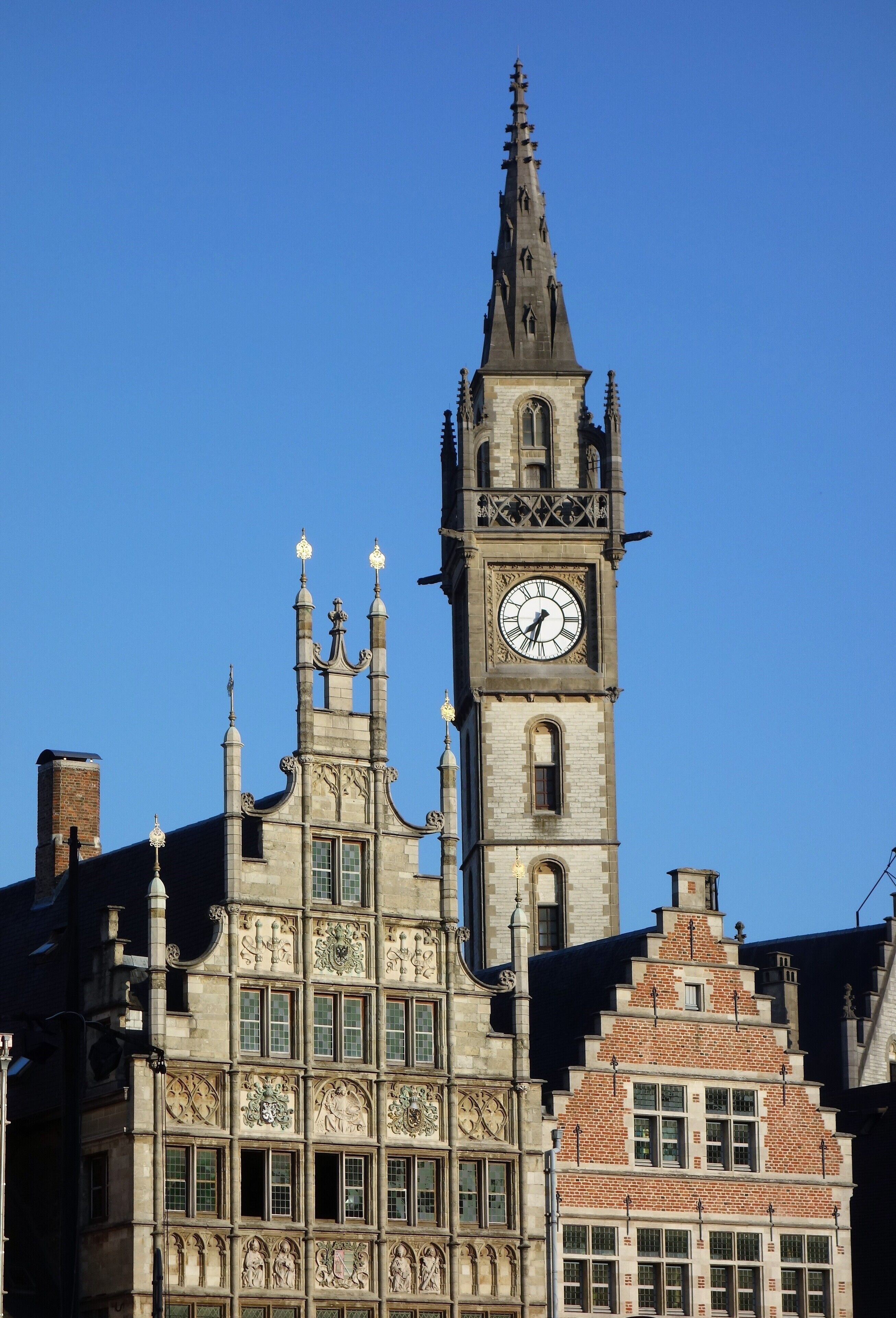 Medieval facades on the “Graslei” (quay of the medieval harbour) and the tower of the old post building. #Ghent  #Trovember