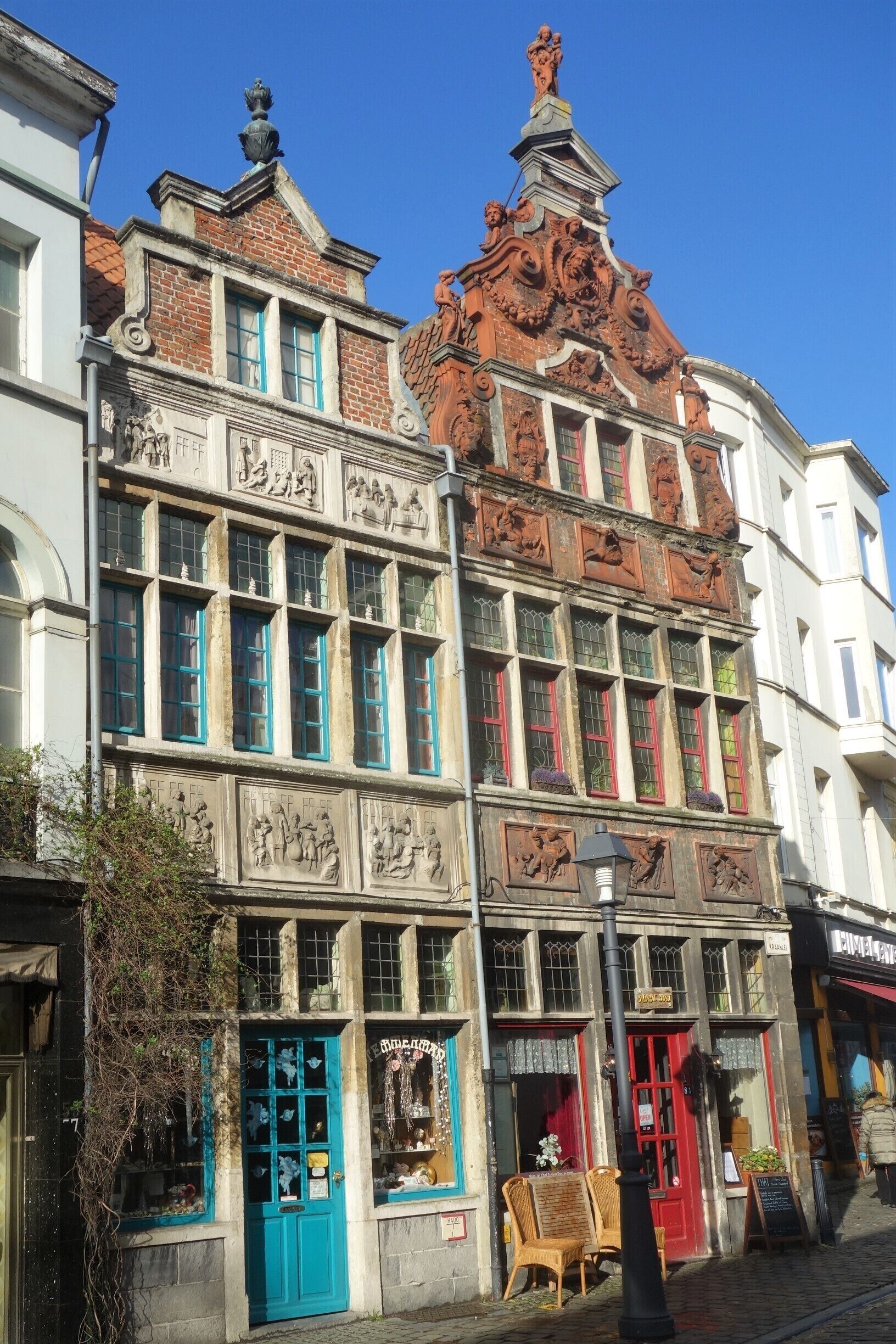 17th-century houses in the old quarter named “Patershol” (Hole of the monks): on the left the house called  “The Works of Mercy”, now a famous, old-fashioned candy store and on the right “The Flute-player” (now fusion restaurant). #Ghent  #Details  #Culture