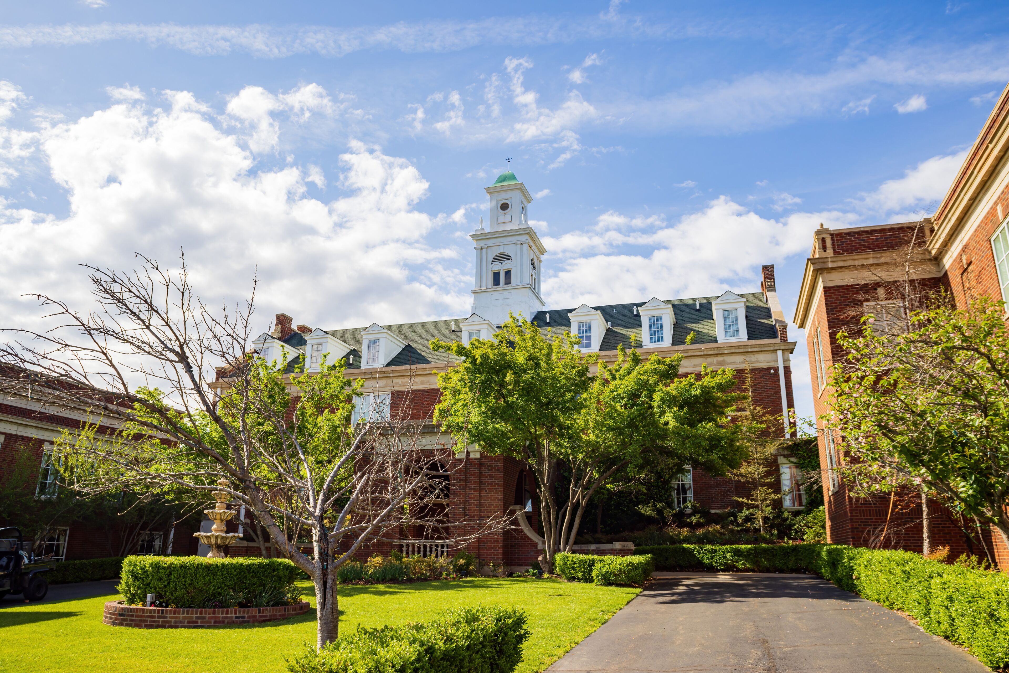 Sunny exterior view of the Dominion House