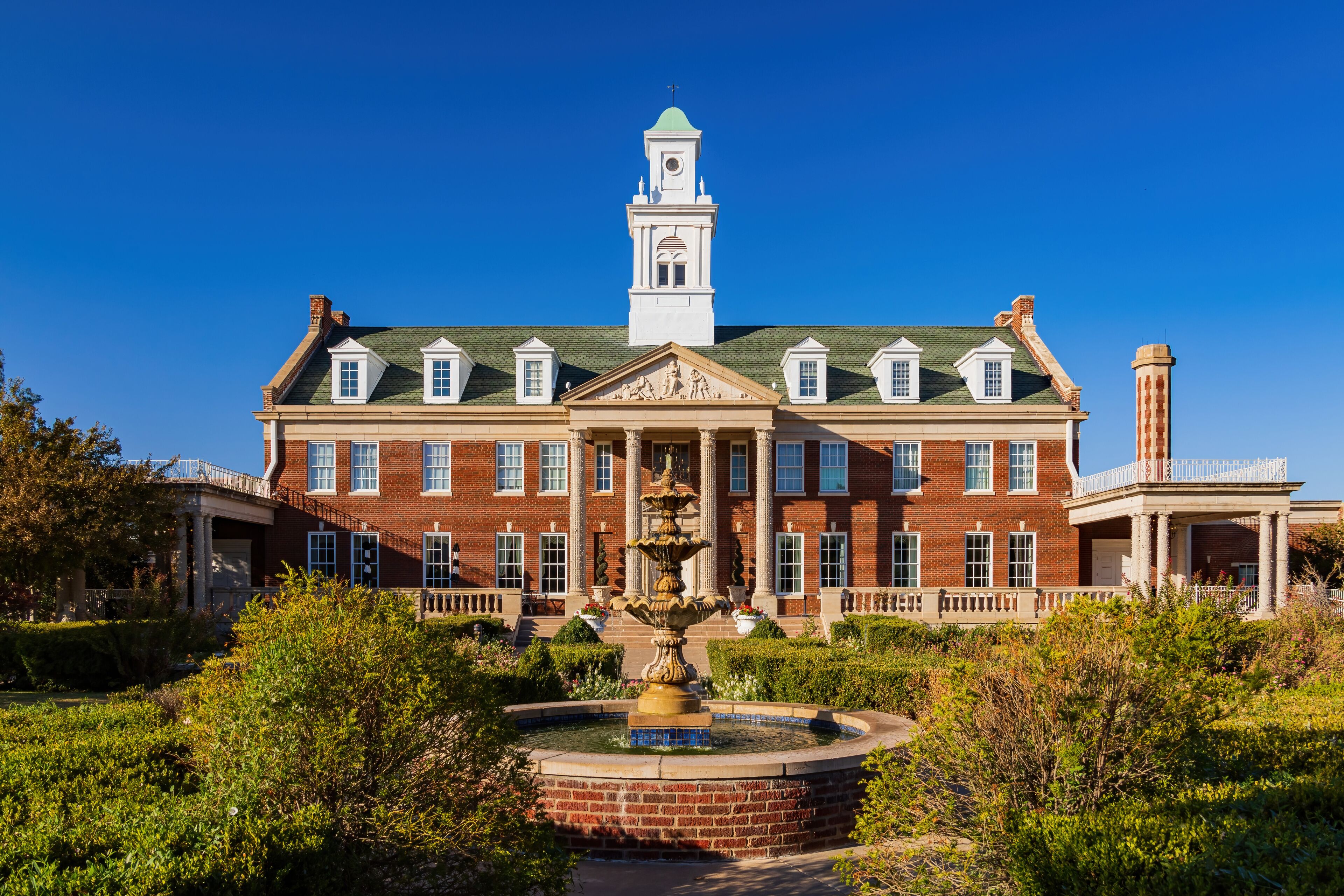 Sunny exterior view of the Dominion House