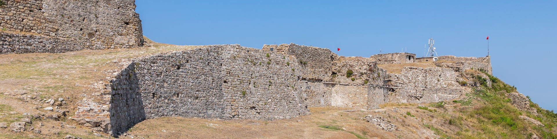 the ruines of Kaninë Castle which was built in the nearby village and the city of Vlore. It is located on the side of the Shushicë Mountain, about 380 metres above sea level and has views on the ocean