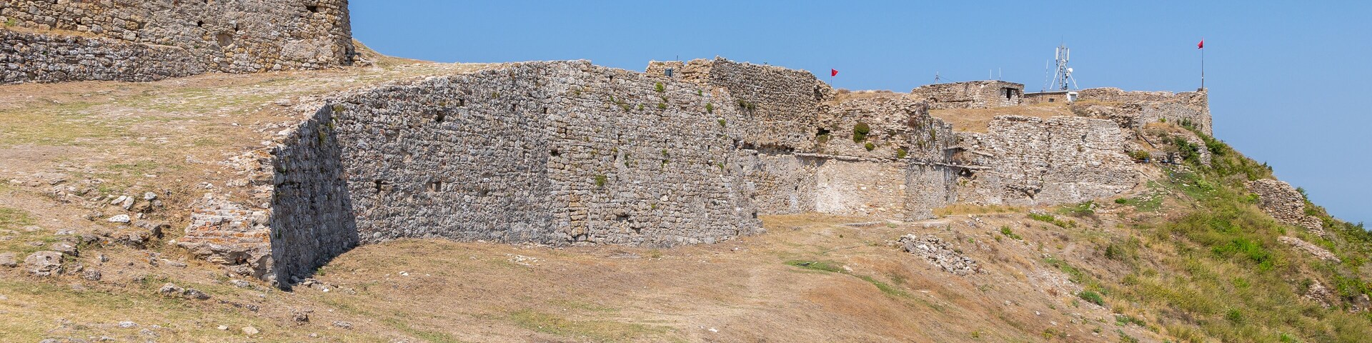 the ruines of Kaninë Castle which was built in the nearby village and the city of Vlore. It is located on the side of the Shushicë Mountain, about 380 metres above sea level and has views on the ocean