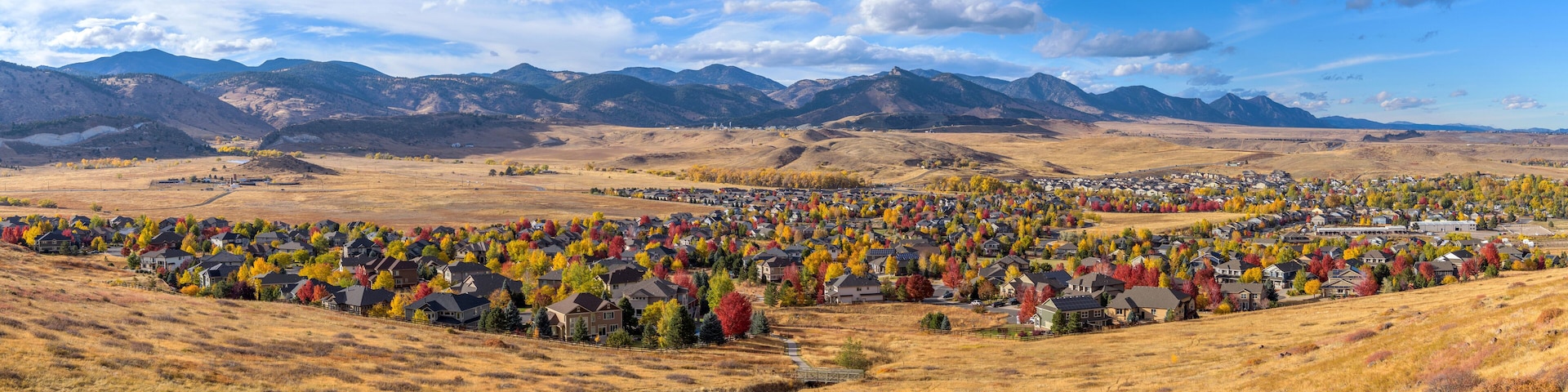 Autumn Foothill Village - A colorful panoramic Autumn day view of a small foothill neighborhood, as seen from North Table Loop Trail. Denver-Golden-Arvada, Colorado, USA.