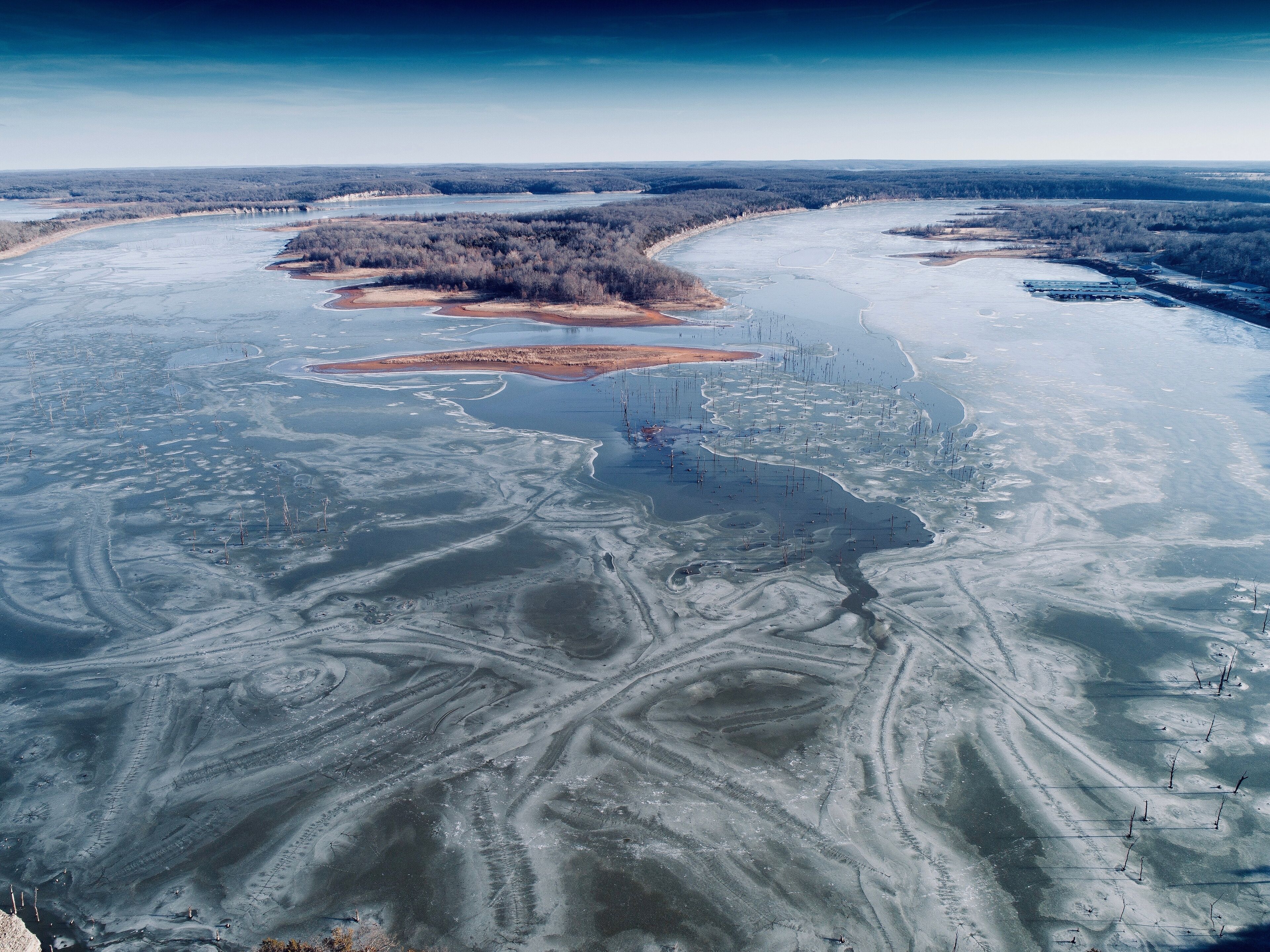 Truman Lake just east of Clinton, Missouri. After a week of freezing weather, this man made lake was just beginning to thaw around the thousands of tree trunks that threaten the hulls of fishing boats