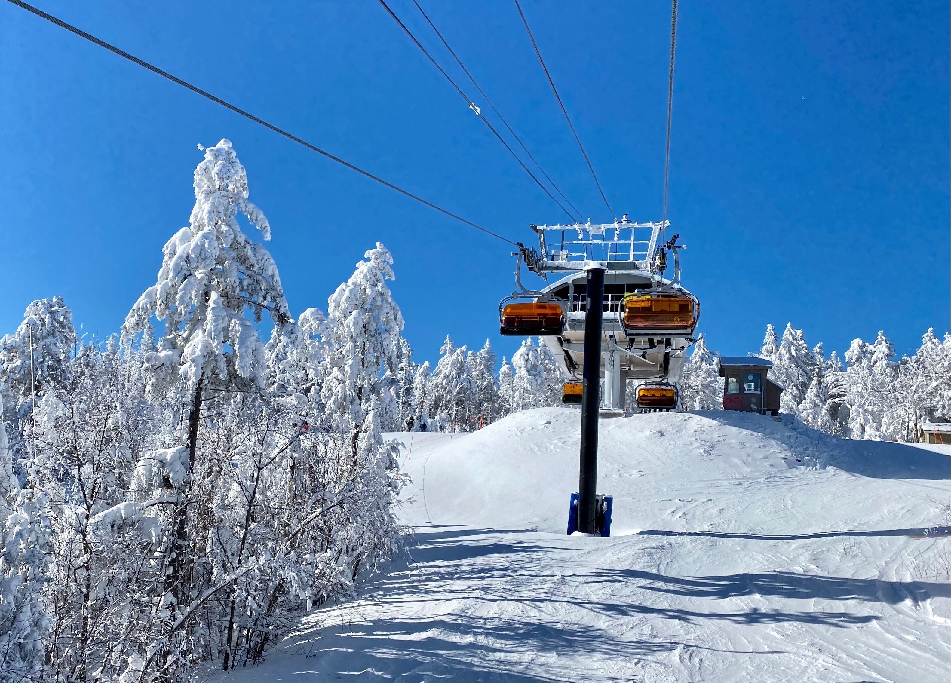 Ski chair lifts at Okemo mountain ski resort at Sunny winter day in Vermont USA