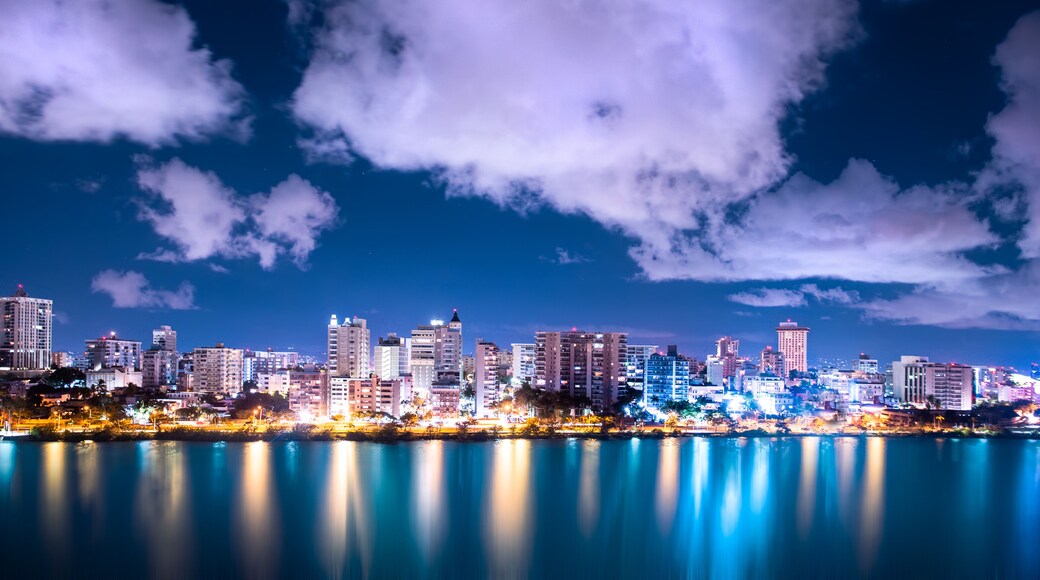 Beautiful Condado Beach, San Juan Puerto Rico seen at night with bay, buildings and lights