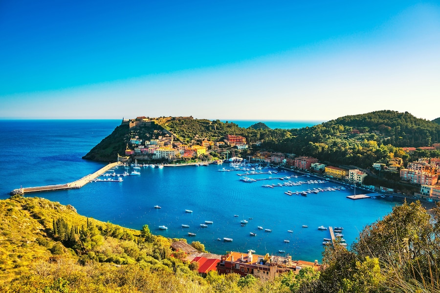 Porto Ercole village and boats in harbor in a sea bay. Aerial view. Monte Argentario, Maremma Grosseto Tuscany, Italy, Shutterstock ID 583938877, SF SSA Case with Manager Approval: Case 07151371, Job: