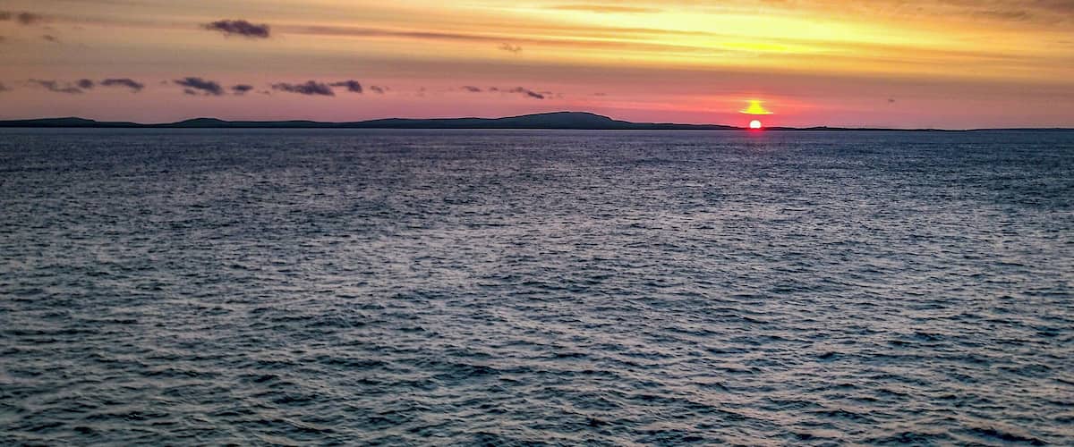 Sunset veiwed from a cruis e ship crossing the Arctic circle.