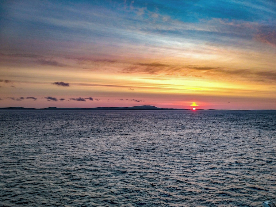 Sunset veiwed from a cruis e ship crossing the Arctic circle.