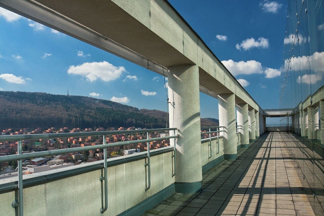 March 2016

Baťa's skyscraper, Zlín, Czech republic 

Tomáš Baťa was born 140 years ago and after WWI he succesfully founded a shoe making business and he became the biggest shoe manufacturer and shoe retail seller in the world before WWII with some 35 thousand employees worldwide. 

In Czech republic he actually reformatted the town of Zlín in South Moravia. In 1926 Baťa invited many architects (eg. Le Corbusier) and built a whole new aglomeration in Functionalism style. Not only the manufacturing halls, but also offices, shopping mall, hospital, cinema hall, hotel and houses for his employees.
 
The flagship was Baťa's skyscraper called also Building Nr. 21, which was built in 1937-38. It is perfect Functionalism style building 77 metres tall having 16 floors. The building had its own air condition system, 24 thousand square metres of offices acommodating some 2.800 staff and conference and showrooms on 15th floor.

This is the panorama terrace on the top of the skyscraper again a pure functional architecture. 