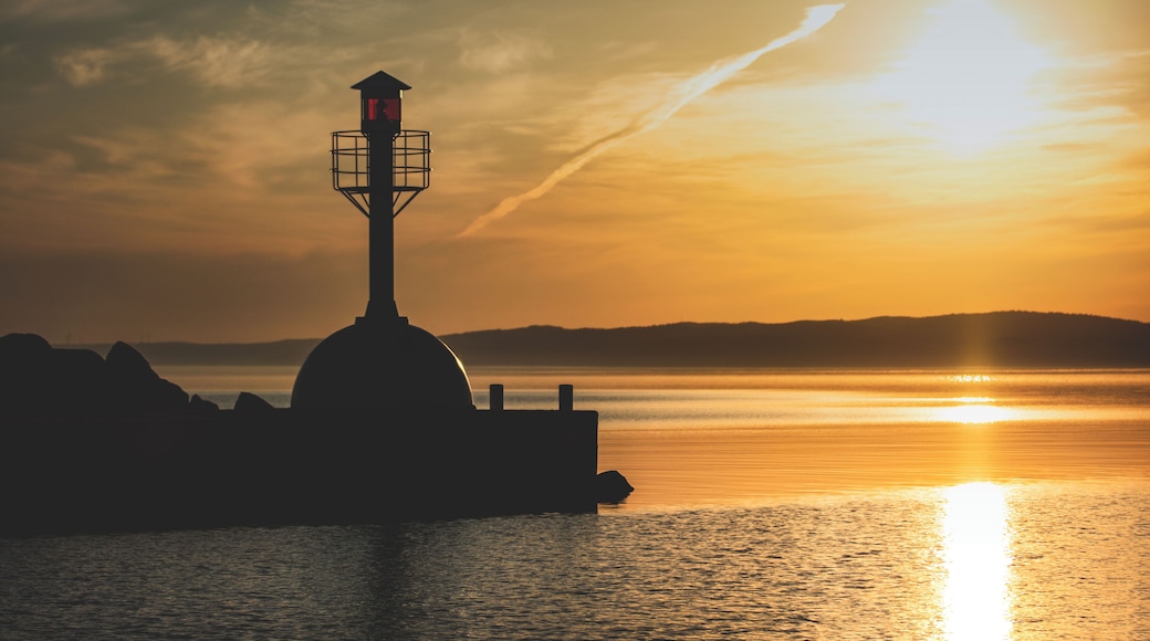 Beautiful place to start the day and enjoy some sunrise photography. Domsand is marina with beaches on both sides by the lake Vättern.