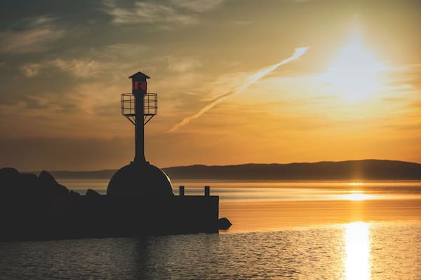 Beautiful place to start the day and enjoy some sunrise photography. Domsand is marina with beaches on both sides by the lake Vättern.