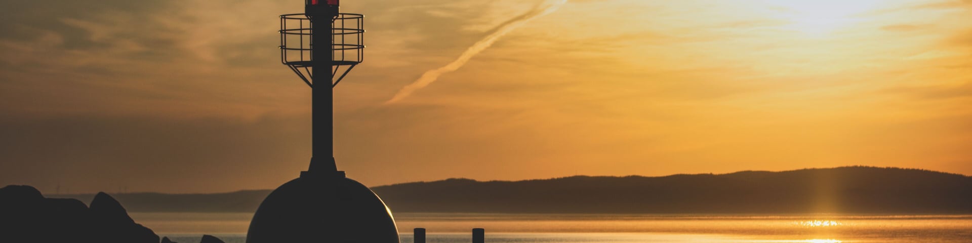Beautiful place to start the day and enjoy some sunrise photography. Domsand is marina with beaches on both sides by the lake Vättern.